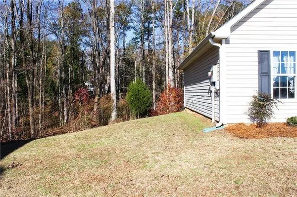 a view of a backyard of the house