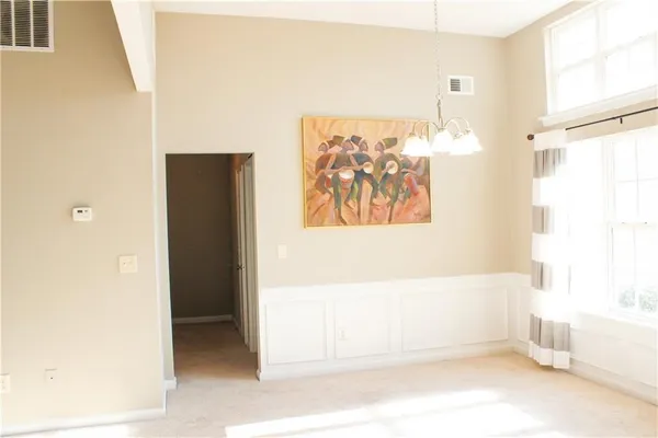 a view of bathroom with bathtub and window