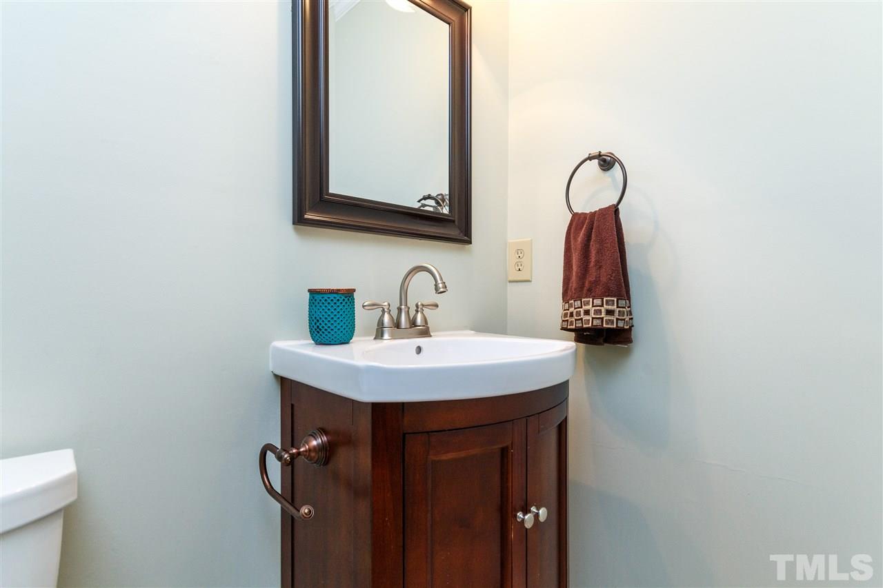 7420 Old Fox Trail Raleigh, NC 27613 - Photo 13 of 28 a bathroom with a sink and a mirror