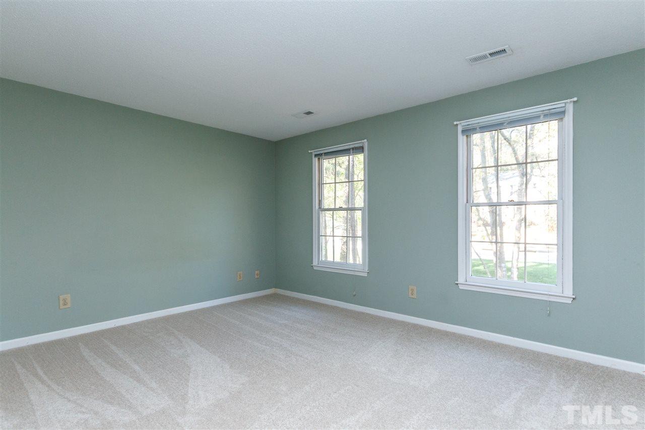 7420 Old Fox Trail Raleigh, NC 27613 - Photo 14 of 28 an empty room with windows