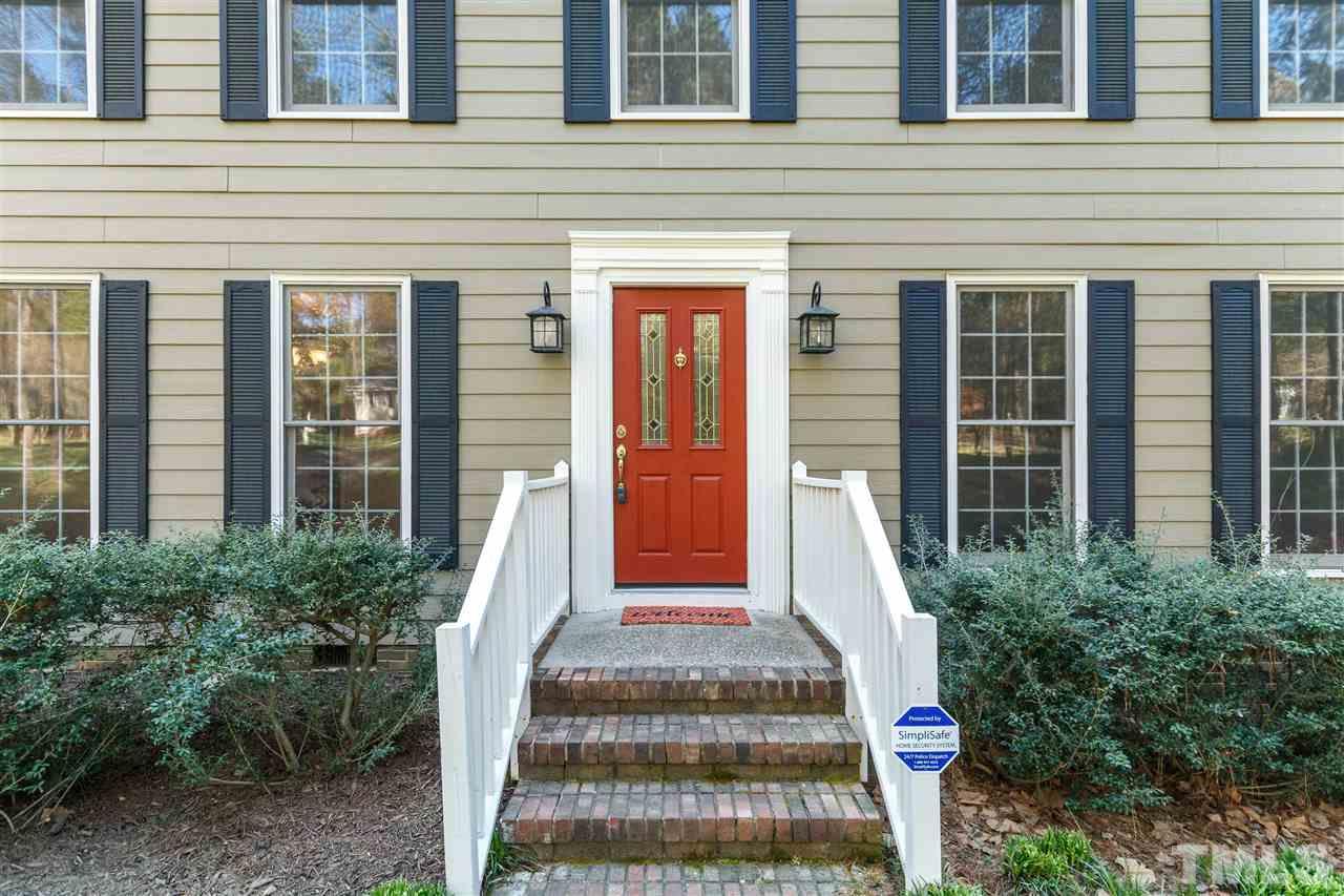 7420 Old Fox Trail Raleigh, NC 27613 - Photo 3 of 28 a front view of a house with a porch