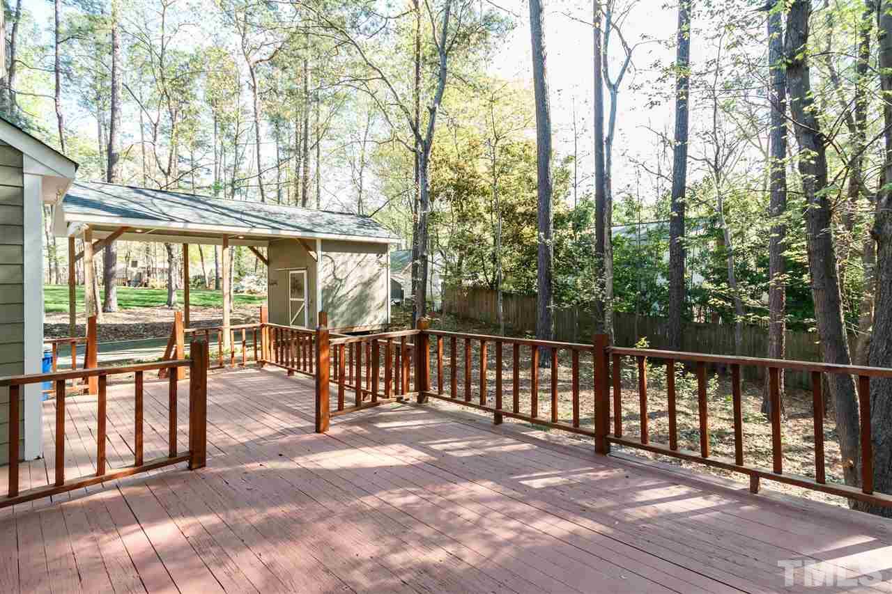 7420 Old Fox Trail Raleigh, NC 27613 - Photo 23 of 28 a view of a chairs and bench in the roof deck