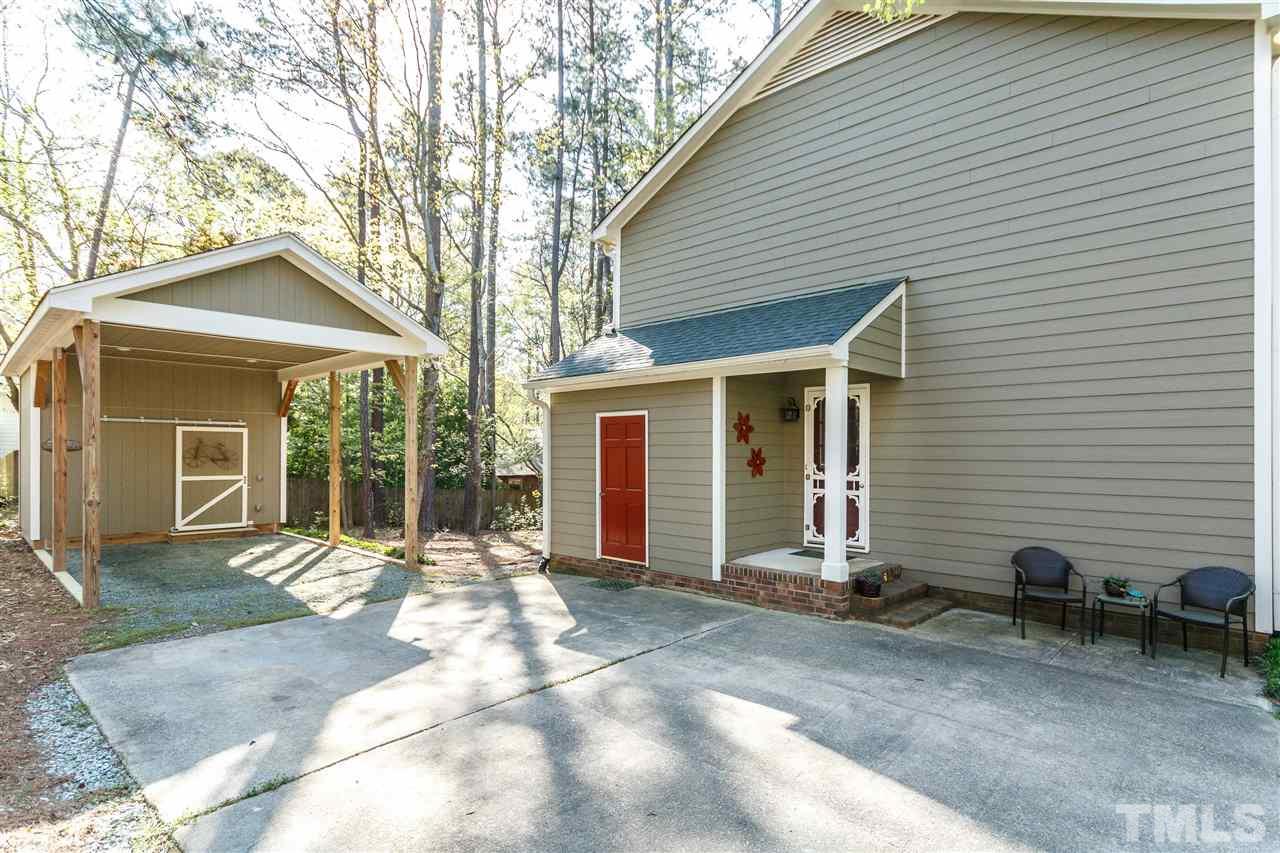 7420 Old Fox Trail Raleigh, NC 27613 - Photo 25 of 28 a front view of a house with a patio
