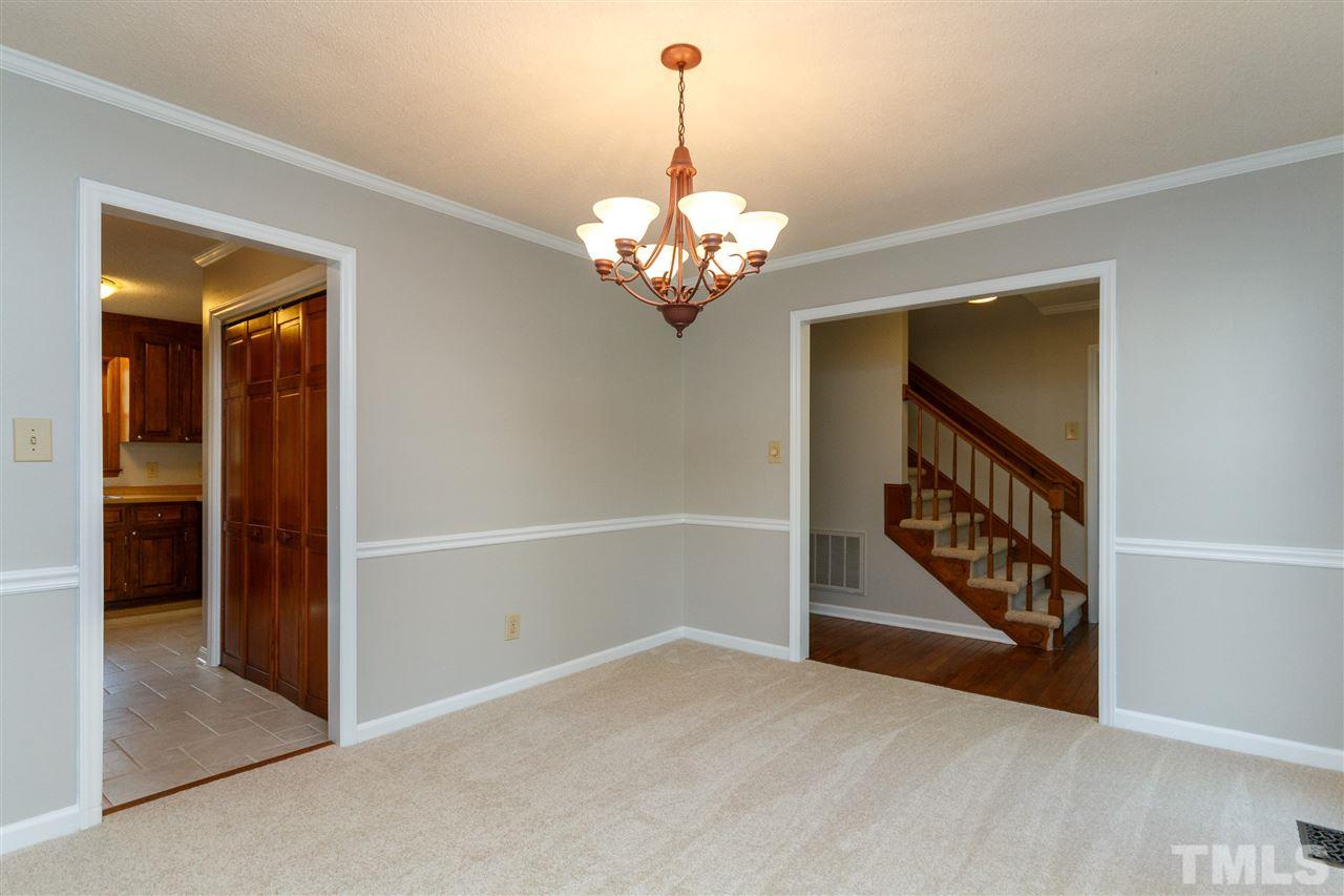 7420 Old Fox Trail Raleigh, NC 27613 - Photo 5 of 28 a view of an entryway with wooden floor