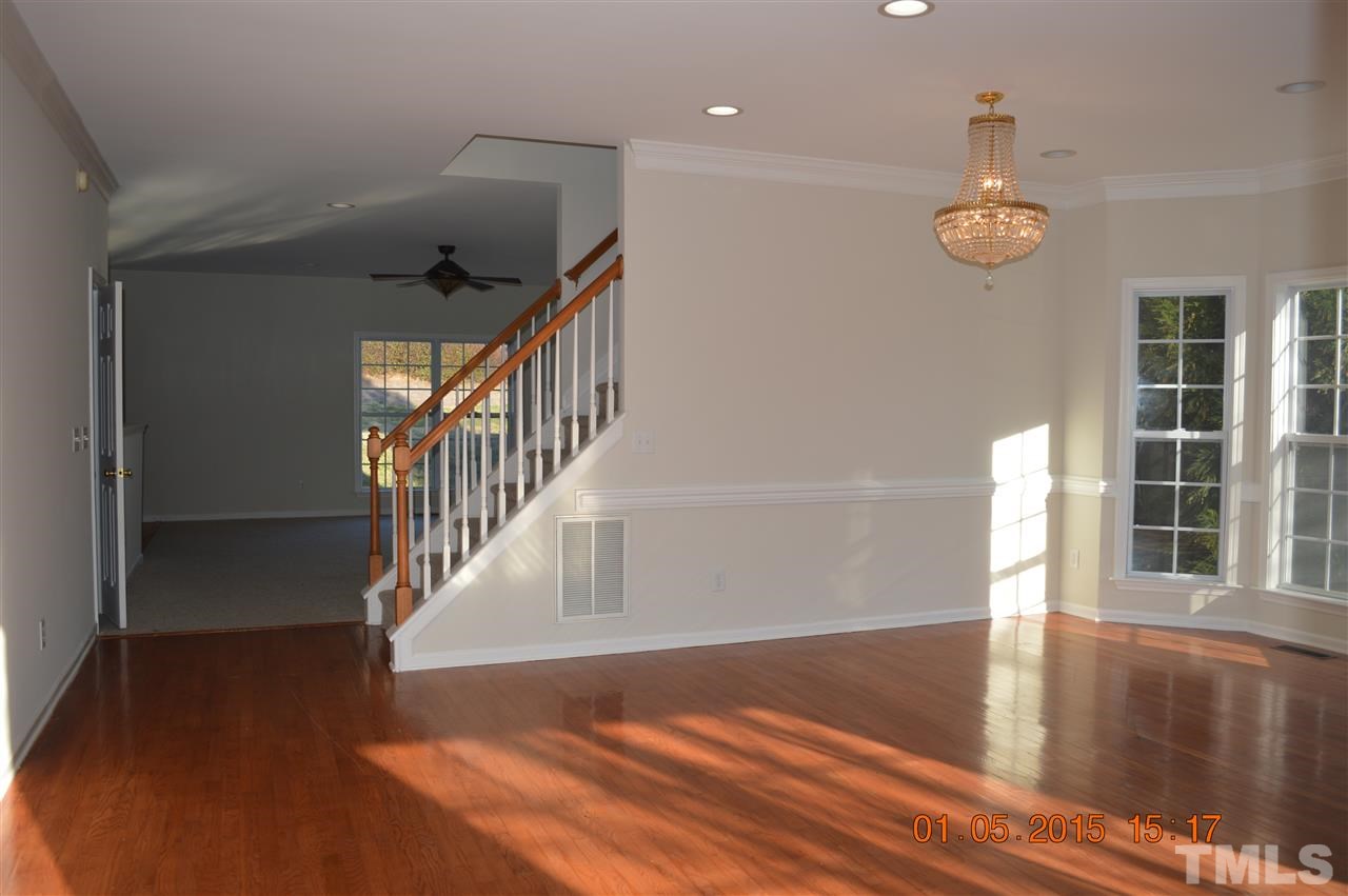 3216 Forest Mill Circle Raleigh, NC 27616 - Photo 2 of 25 a view of an entryway with wooden floor