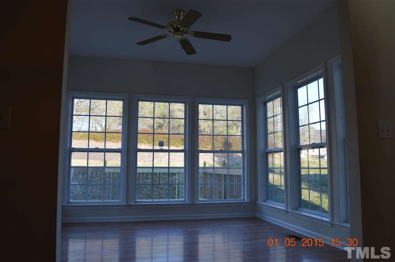 3216 Forest Mill Circle Raleigh, NC 27616 - Photo 12 of 25 a view of empty room with wooden floor and fan