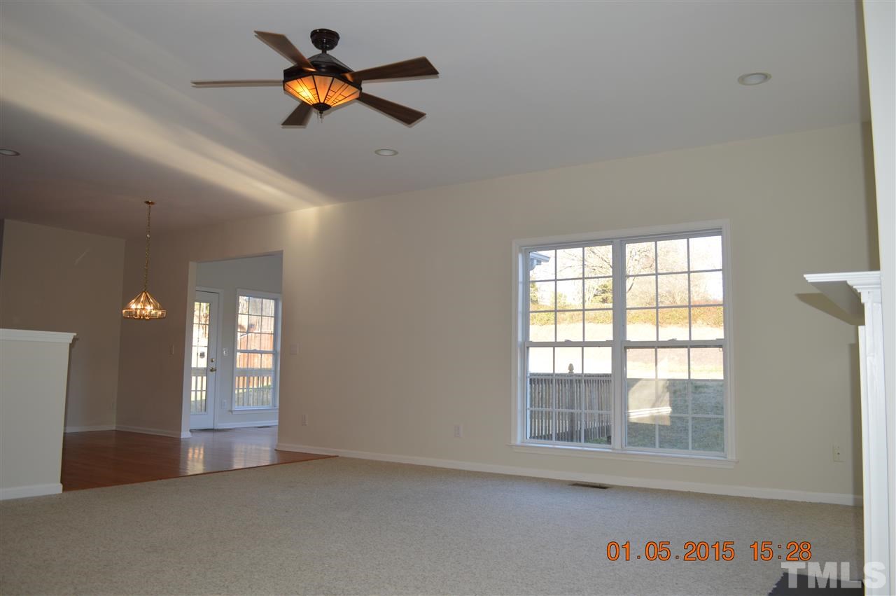 3216 Forest Mill Circle Raleigh, NC 27616 - Photo 4 of 25 a view of an empty room with window and cabinet