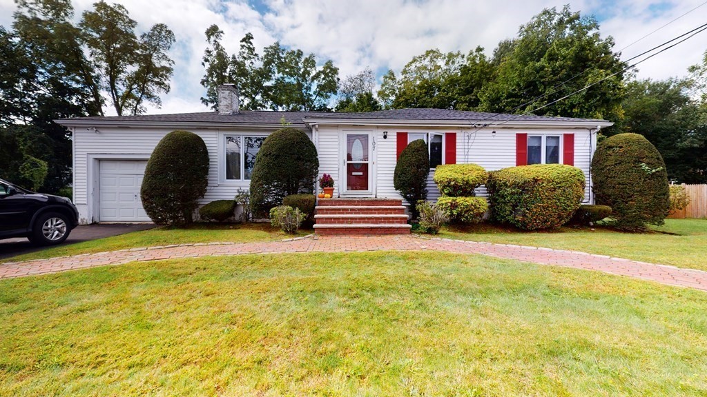 107 Truman Road Newton, MA 02459 - Photo 1 of 22 a front view of a house with a yard