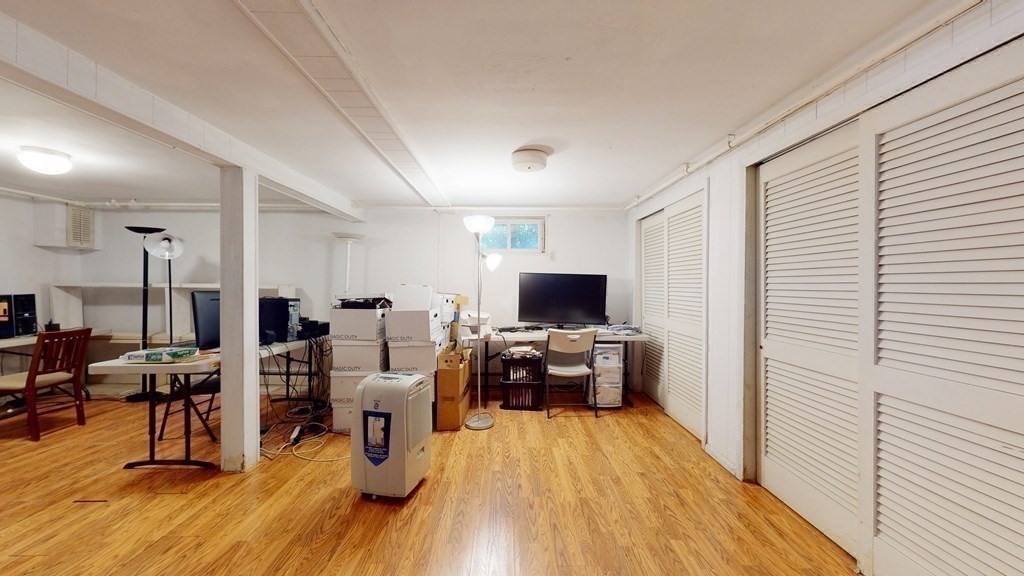 107 Truman Road Newton, MA 02459 - Photo 17 of 22 a living room with furniture and a flat screen tv
