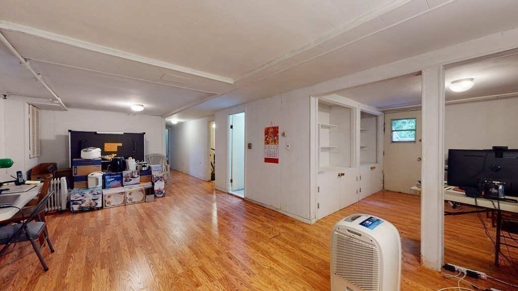 107 Truman Road Newton, MA 02459 - Photo 18 of 22 a view of a livingroom with furniture and a flat screen tv