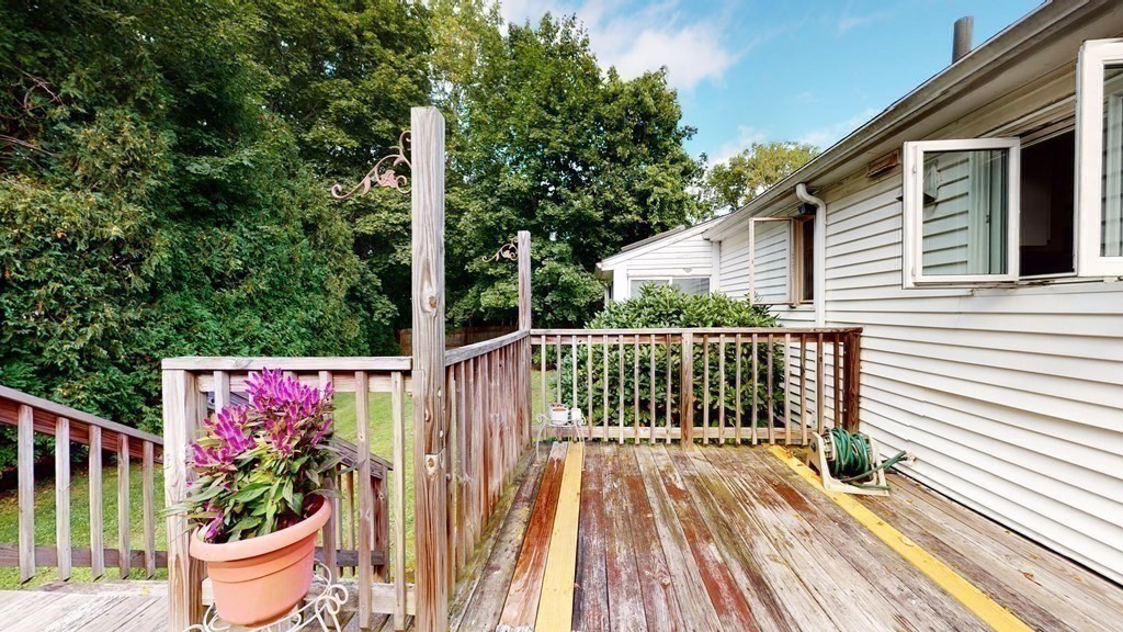 107 Truman Road Newton, MA 02459 - Photo 19 of 22 a view of a two chairs and table in the balcony
