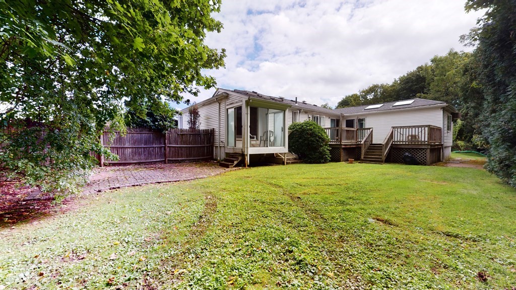107 Truman Road Newton, MA 02459 - Photo 21 of 22 a front view of a house with a garden and trees
