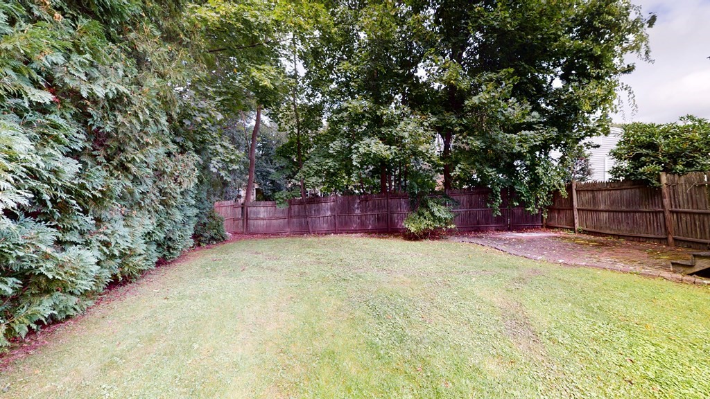 107 Truman Road Newton, MA 02459 - Photo 22 of 22 a big yard with large trees