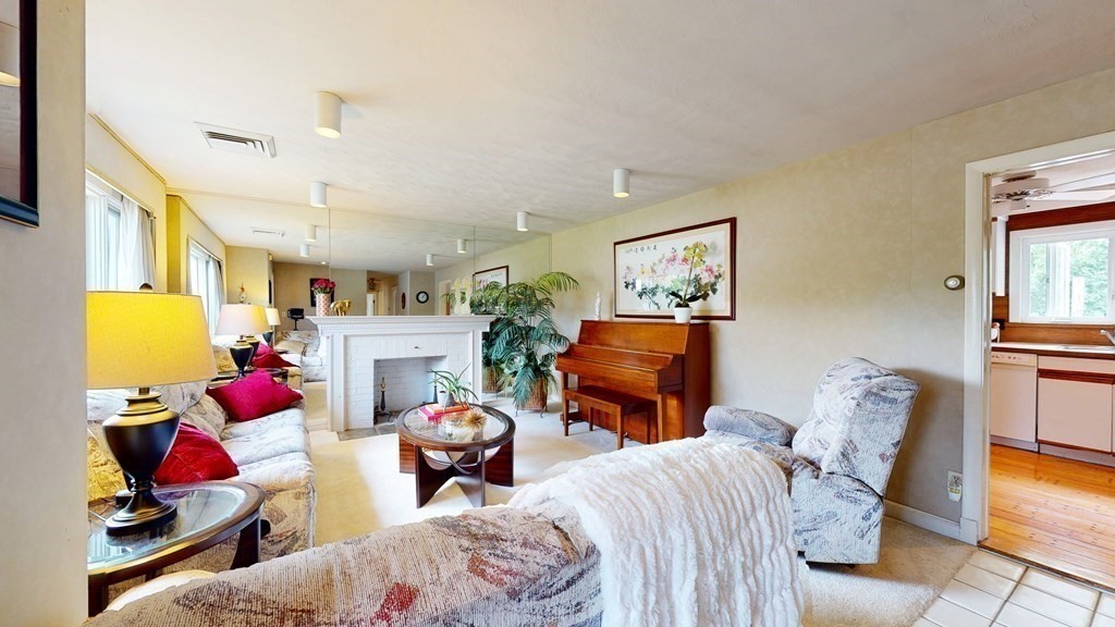 107 Truman Road Newton, MA 02459 - Photo 4 of 22 a living room with furniture a rug and a lamp