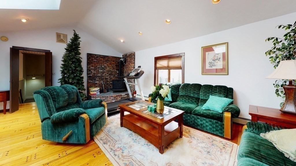 107 Truman Road Newton, MA 02459 - Photo 9 of 22 a living room with furniture fireplace and a window
