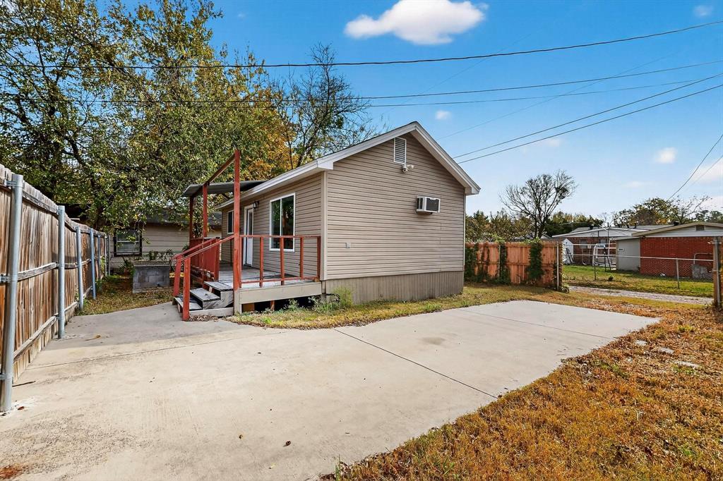 401 East Miller Road Garland, TX 75041 - Photo 13 of 18 a view of a house with backyard and trees