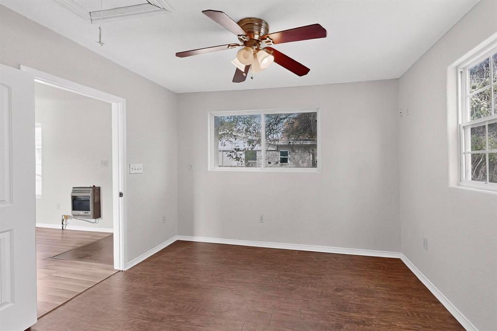 401 East Miller Road Garland, TX 75041 - Photo 16 of 18 wooden floor in an empty room with a window