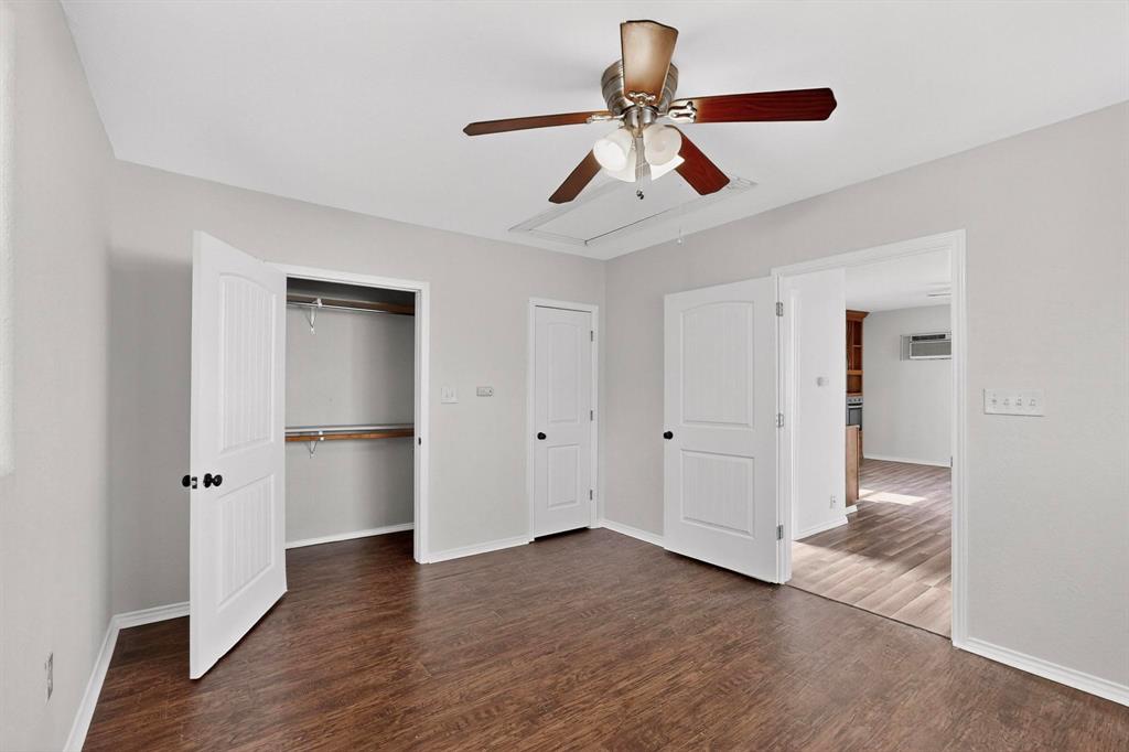 401 East Miller Road Garland, TX 75041 - Photo 17 of 18 a view of an empty room and wooden floor