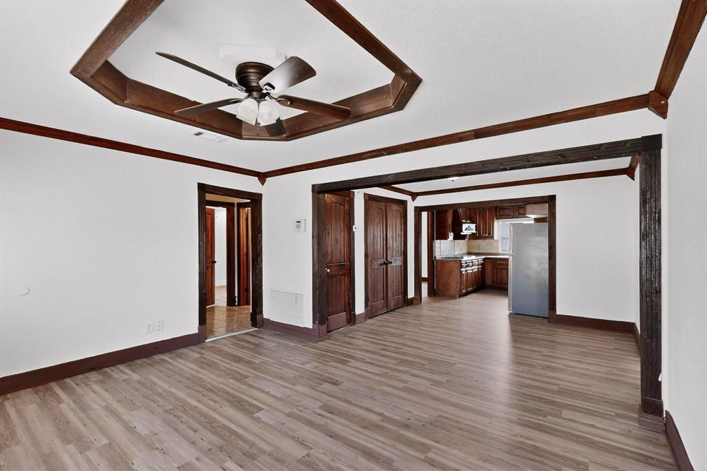 401 East Miller Road Garland, TX 75041 - Photo 4 of 18 a view of a hallway view with wooden floor and staircase