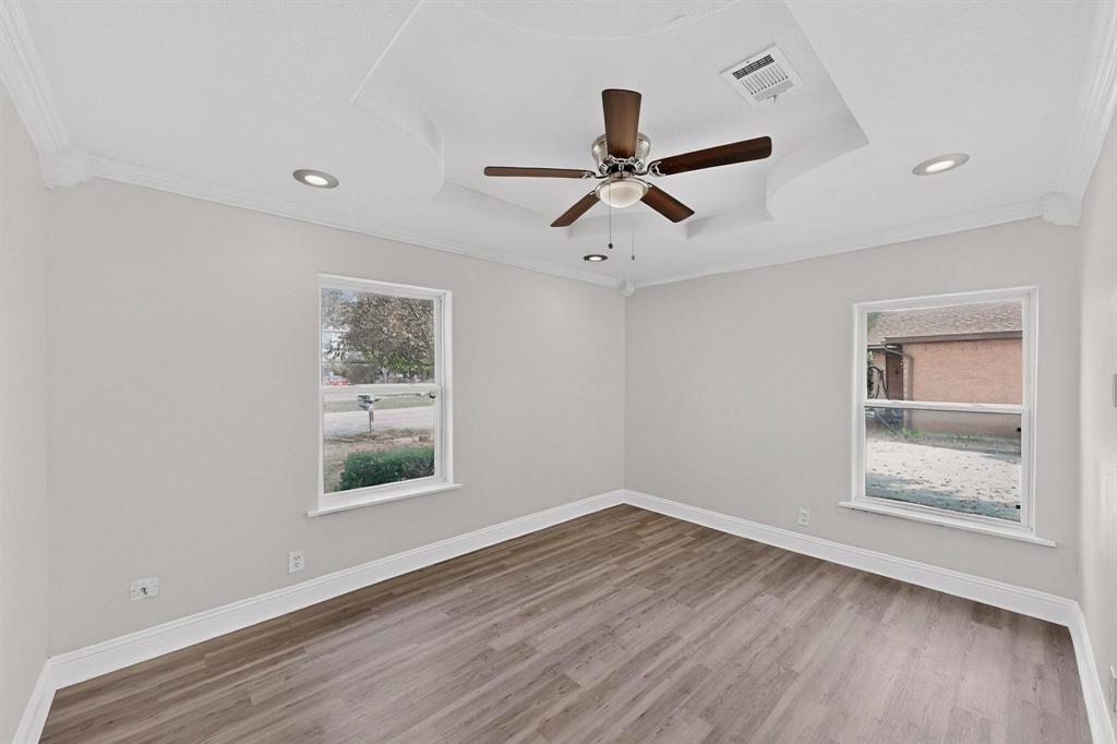 401 East Miller Road Garland, TX 75041 - Photo 9 of 18 a view of room window and wooden floor