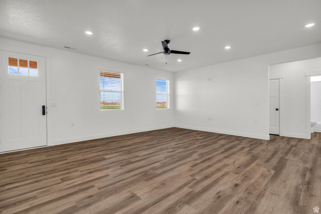 520 East 450th Street North Delta, UT 84624 - Photo 10 of 48 Empty room featuring recessed lighting, a ceiling fan, and dark wood-style flooring