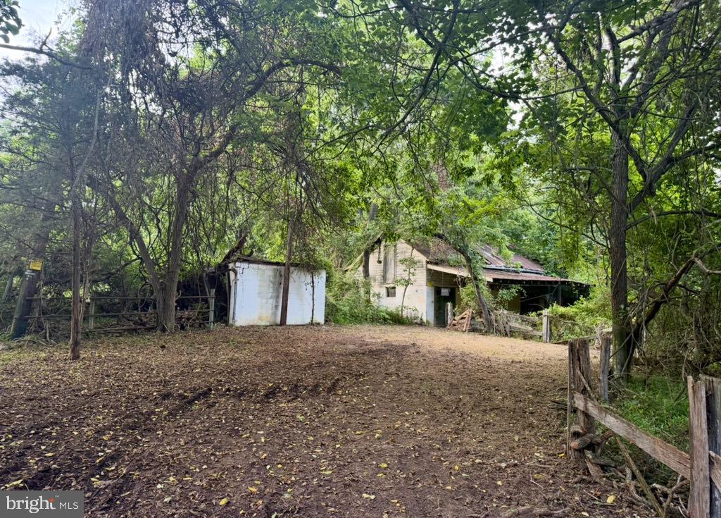 Dimes Road Derwood, MD 20855 - Photo 2 of 2 a front view of a house with a yard and garage