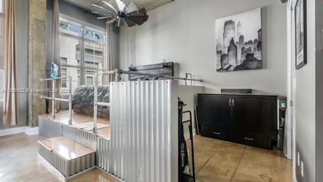 a room with a washing machine and a fireplace