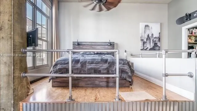 a large kitchen with stainless steel appliances granite countertop a lot of counter space and a window