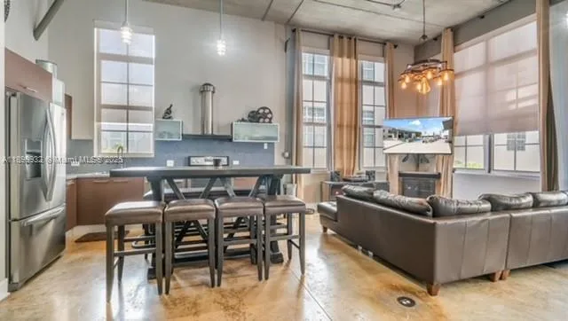 a view of a dining room with furniture window and outside view