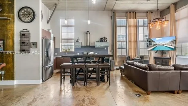 a kitchen with stainless steel appliances granite countertop a sink and a stove