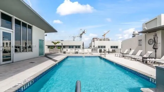 a living room with lots of furniture and a chandelier