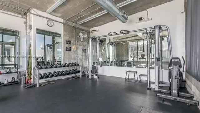 a view of a lobby with gym equipment
