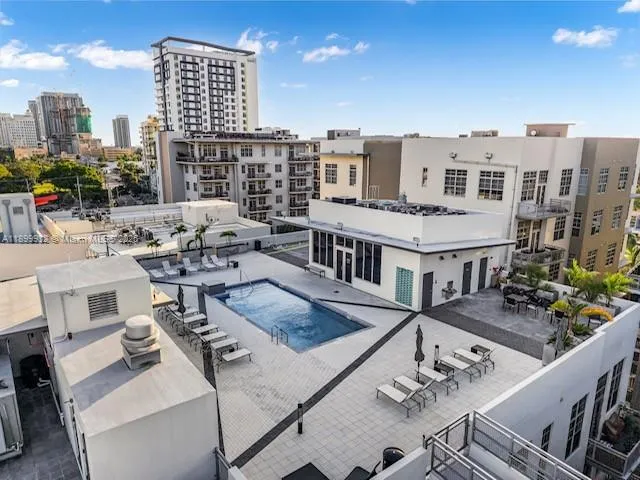 a view of a balcony with chairs and a table
