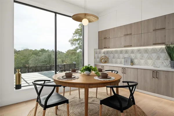 a view of a dining room with furniture window and outside view