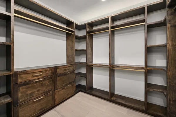 a view of an empty walk in closet