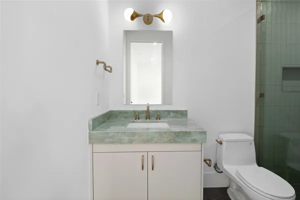 a bathroom with a shower and toilet