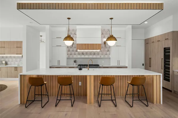 a kitchen with a table and chairs in it