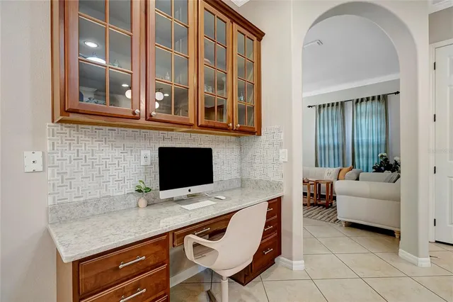 a living room with furniture or chandelier and a couch