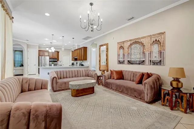 a bedroom with a bed and painting on the wall