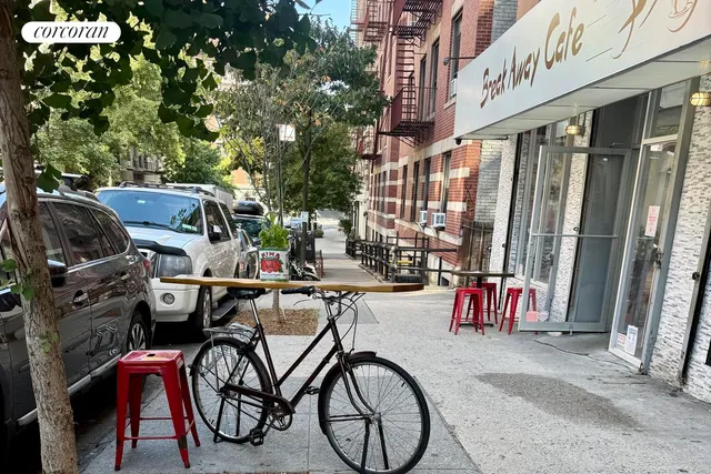 a view of path along with retail shop and buildings