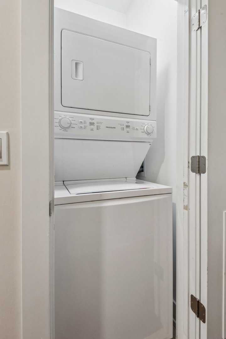 1011 North Wolcott Avenue, Unit 2N Chicago, IL 60622 - Photo 22 of 23 a close up view of washer and dryer