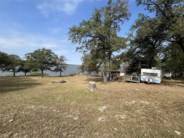 a view of a lake with houses in the back
