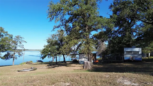 front view of a house with a tree