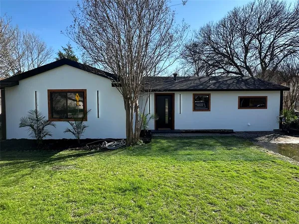 a backyard of a house with lots of green space