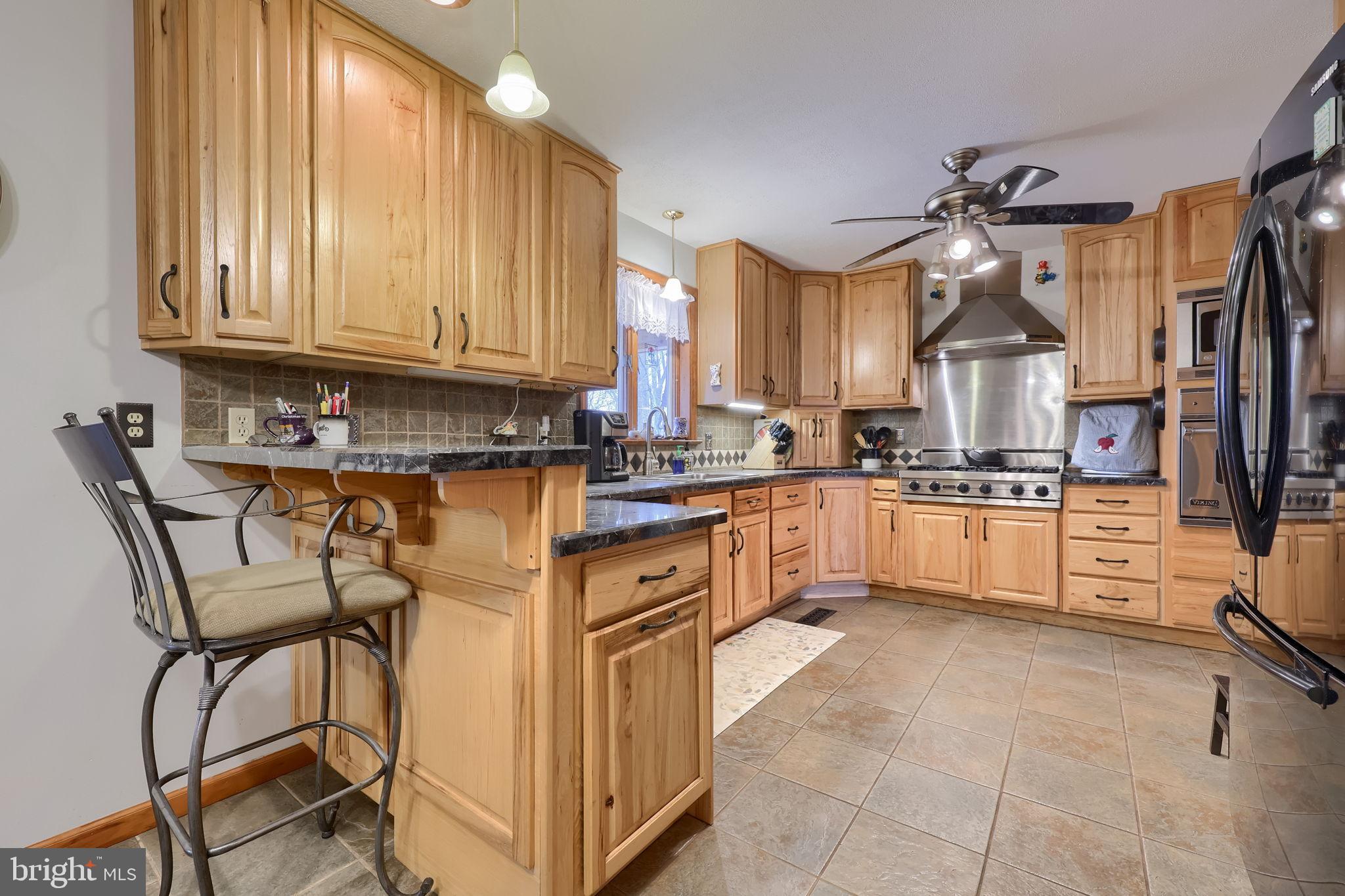 258 Beaver Road Birdsboro, PA 19508 - Photo 15 of 59 Warm wood tones in a modern kitchen space.