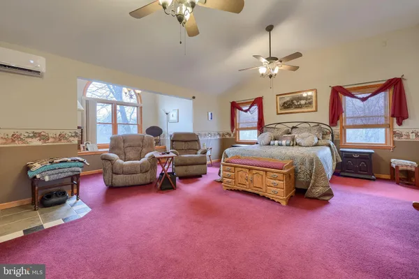 a view of a livingroom with furniture and chandelier
