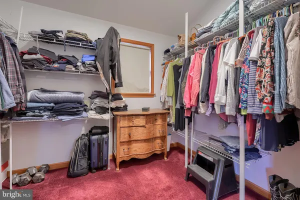 a bathroom with a tub a sink and a shower