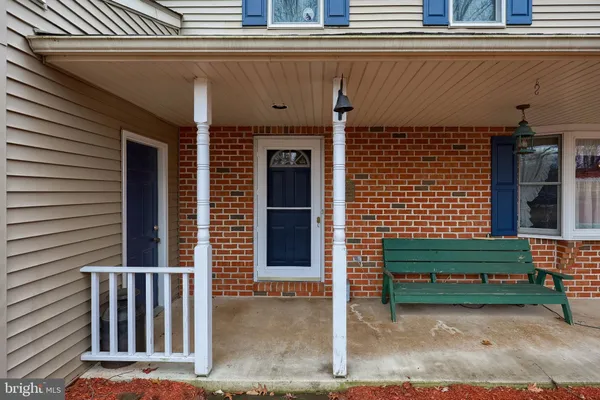 a front view of a house with a fence