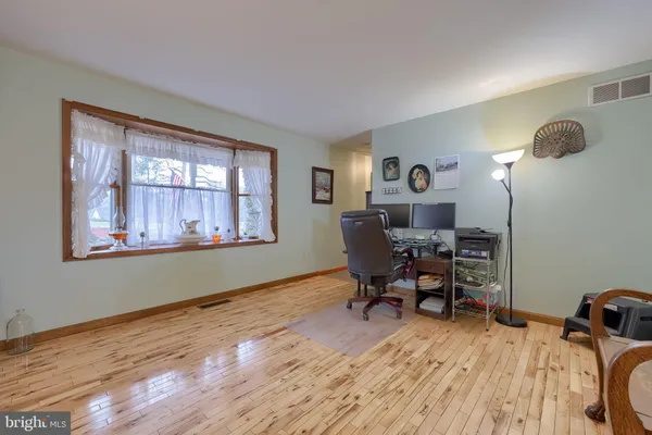 a workspace with wooden floor