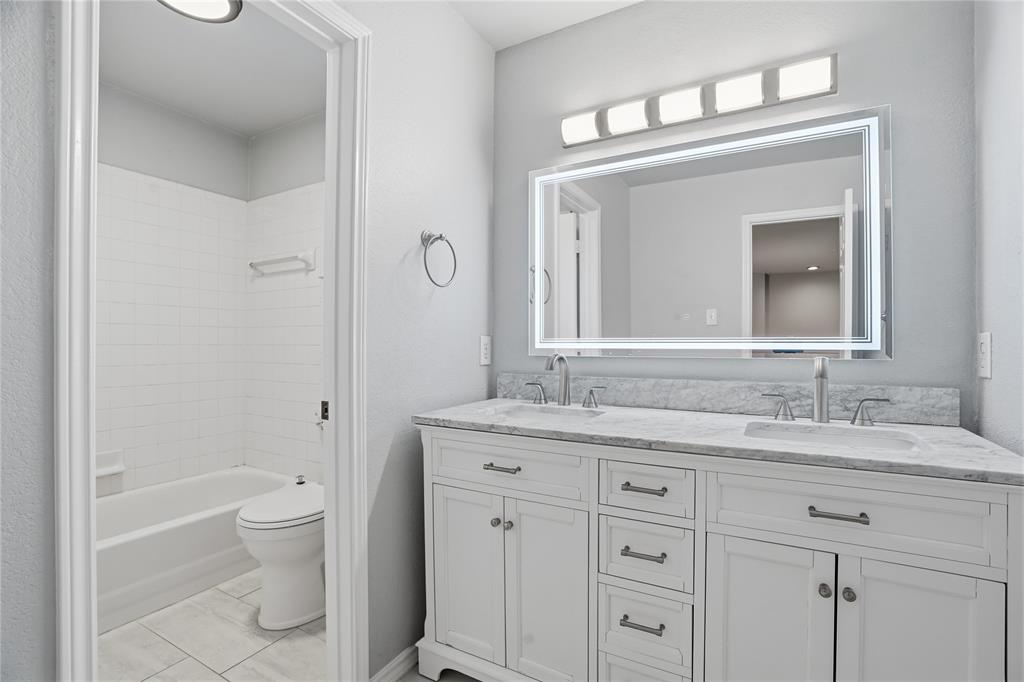 2133 Rustic Ridge Drive Keller, TX 76248 - Photo 19 of 40 Updated Bathroom with double vanity and shower / tub combination